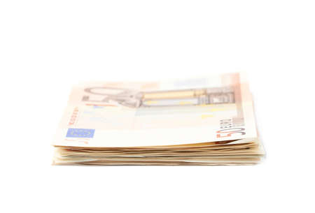 Stack pile of fifty euro bank notes isolated over the white backgroundの写真素材