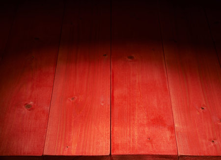 Red paint coated wooden boards copyspace background composition with the low key lightingの写真素材