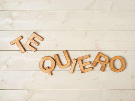 Te Quiero meaning I Love You in Spanish written with the block letters over the wooden backgroundの写真素材