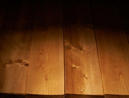 Brown paint coated wooden boards copyspace background composition with the low key lightingの写真素材