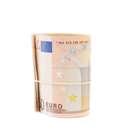 Stack of fifty euro bank notes bend in a form of tube, composition isolated over the white backgroundの写真素材