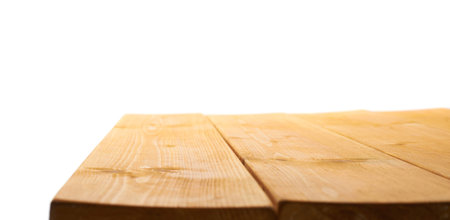 Yellow paint coated wooden pine boards as a copyspace background composition isolated over the white backgroundの写真素材