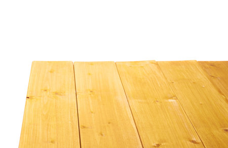 Yellow paint coated wooden pine boards as a copyspace background composition isolated over the white backgroundの写真素材
