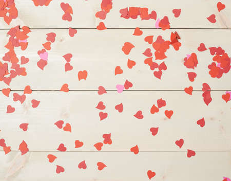 Surface covered with heart shaped confetti as Valentines Day love background compositionの写真素材