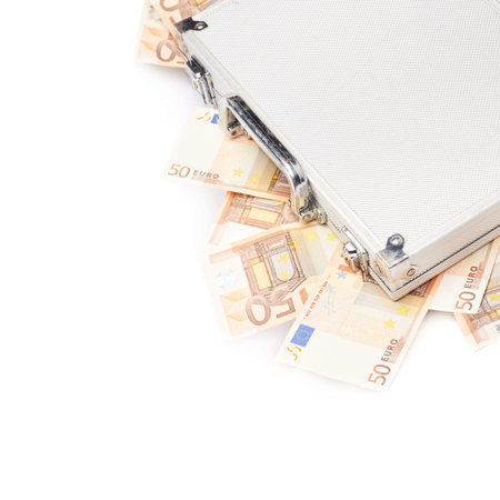 Suitcase full of fifty euro bank note bills isolated over the white backgroundの写真素材
