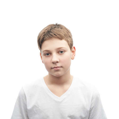 Caucasian 12 years old children boy in a white t-shirt, portrait isolated over the white backgroundの写真素材
