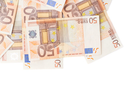 Surface covered with multiple fifty euro bank notes isolated over the white background