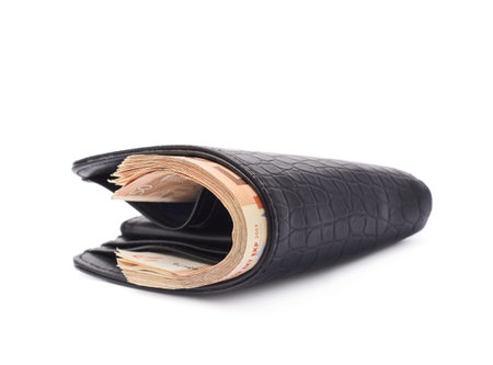 Black leather wallet full of fifty euro bank notes isolated over the white background