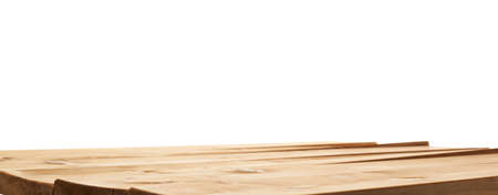 Brown paint coated wooden pine boards as a copyspace background composition isolated over the white backgroundの写真素材