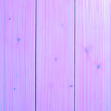 Violet paint coated wooden pine boards lying in a row as a close-up background compositionの写真素材