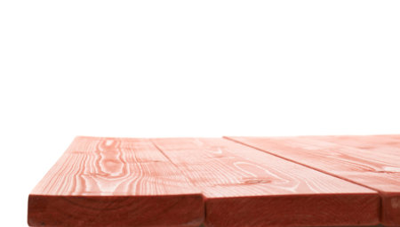 Red paint coated wooden pine boards as a copyspace background composition isolated over the white...