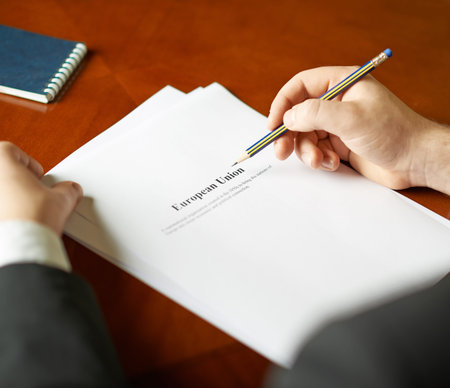 European Union definition as a shallow depth of field close-up composition of a man in a business...
