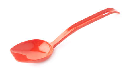 Red glossy plastic kitchen cooking scoop isolated over the white backgroundの写真素材