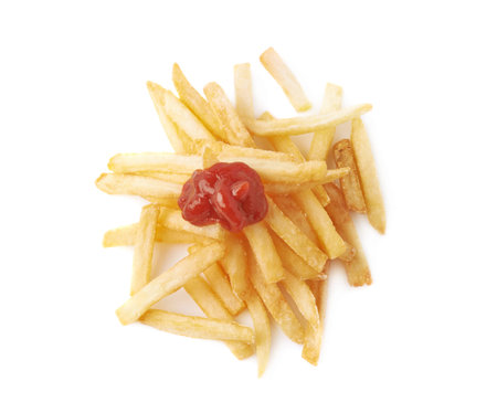 Pile of cooked golden yellow french fries potatoes covered with ketchup sauce, composition isolated...