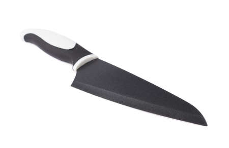 Steel kitchen knife with the black and white handle isolated over the white の写真素材