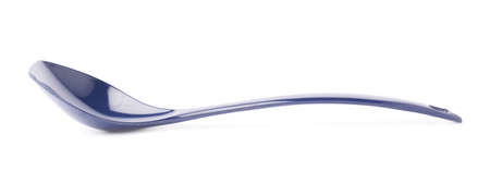 Blue plastic kitchen ladle serving spoon isolated over the white の写真素材