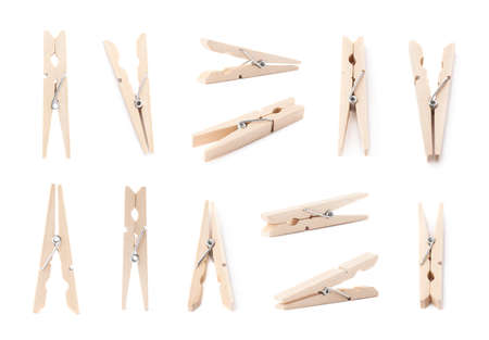 Set of multiple wooden clothespin pins in different foreshortenings, isolated over the white の写真素材