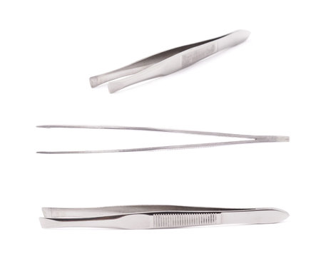 Cosmetic metal tweezers isolated over the white background, set of three different foreshorteningsの写真素材