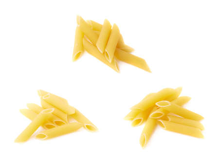 Small pile of dried yellow penne pasta isolated over the white backgroundの写真素材