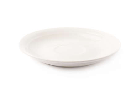 Small white glazed ceramic plate isolated over the white backgroundの写真素材