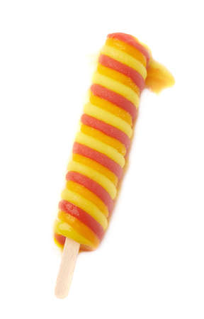 Colorful, twisted frozen fruit juice ice pop snack on a wooden stick shot in a process of melting down, composition isolated over the white backgroundの写真素材