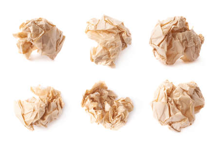 Crumpled ball of brown wrapping paper isolated over the white background, set of six different imagesの写真素材