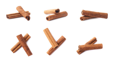 Pile of cinnamon sticks compositions isolated over the white background, set of multiple different foreshorteningsの写真素材