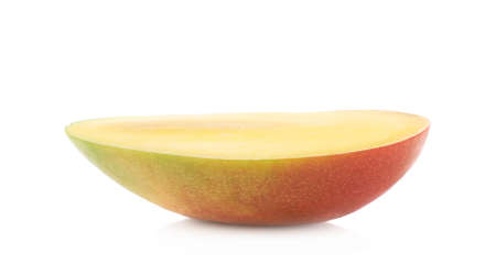 Half of a mango fruit isolated over the white backgroundの写真素材