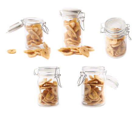 Glass jar filled with the dried banana snack slices, composition isolated over the white backgroundの写真素材