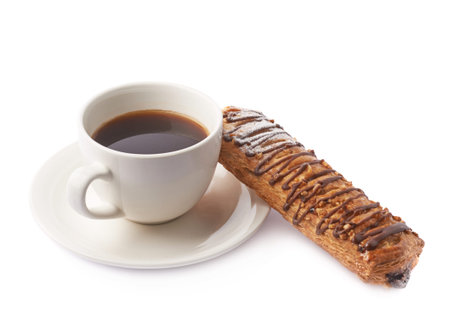 Sweet pastry bread bun and cup of black coffee espresso, composition isolated over the white...