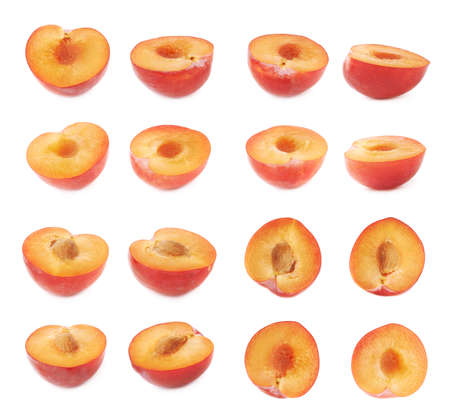 Cut open half of a red victoria plum isolated over the white background, set of multiple different foreshorteningsの写真素材