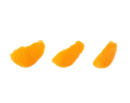 Slice sections of ripe tangerine isolated over the white backgroundの写真素材