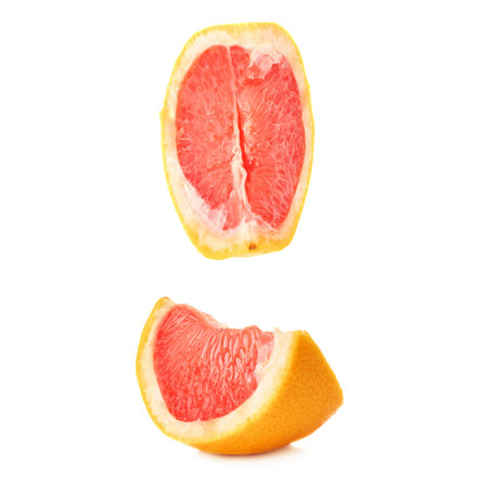 Slice section of ripe grapefruit isolated over the white backgroundの写真素材