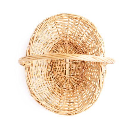 Brown small wicker basket isolated over the white backgroundの写真素材