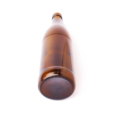 Empty brown beer glass bottle isolated over white backgroundの写真素材