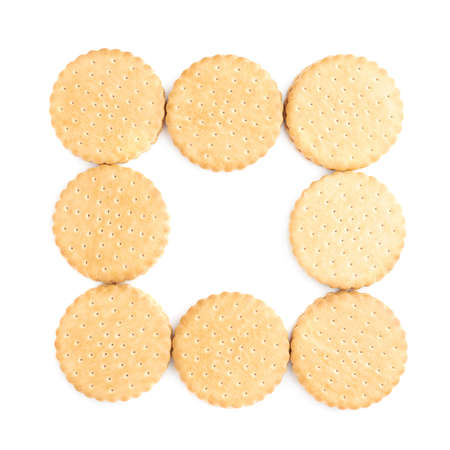 Pile of round cookies with the pieces of chocolate isolated over the white backgroundの写真素材