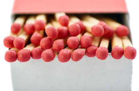 Pile of Wooden unused matches in box isolated over the white backgroundの写真素材