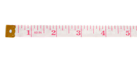 Red Tailor measuring tape isolated over the white backgroundの写真素材
