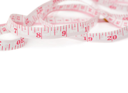 Red Tailor measuring tape isolated over the white background