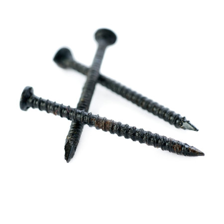 Small black Pail of Metal nails isolated over the white background
