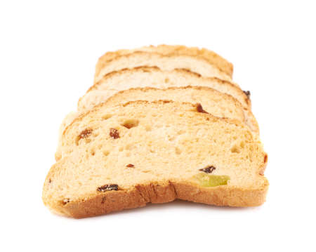 Pile of rusks with the pieces of dried fruits isolated over the white backgroundの写真素材