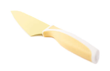 Steel yellow kitchen knife isolated over the white backgroundの写真素材