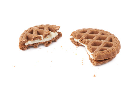 Broken into pieces round cookie isolated over the white background