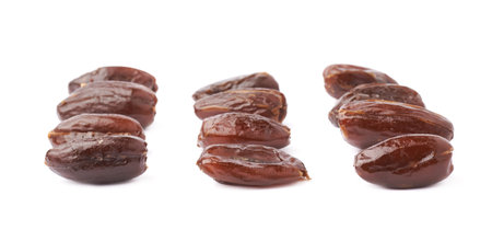 Many date fruits over isolated white background surface