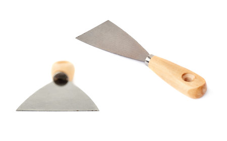 Set of Putty kniFe with wooden handle over isolated white background