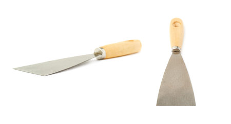Set of Putty kniFe with wooden handle over isolated white backgroundの写真素材
