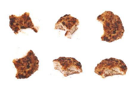 Bitten single prepared small hand made cutlet isolated over white background