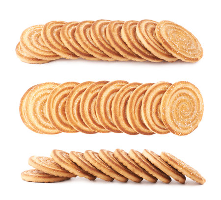 Line of round cookies with the pieces of chocolate isolated over the white background