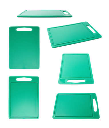 Unused brand new plastic green cutting board isolated over the white backgroundの写真素材