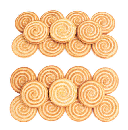 Pile of round cookies with the pieces of chocolate isolated over the white backgroundの写真素材